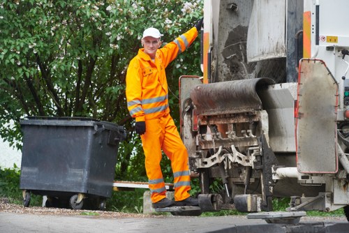 Clearing debris and vegetation during site clearance in Clapham